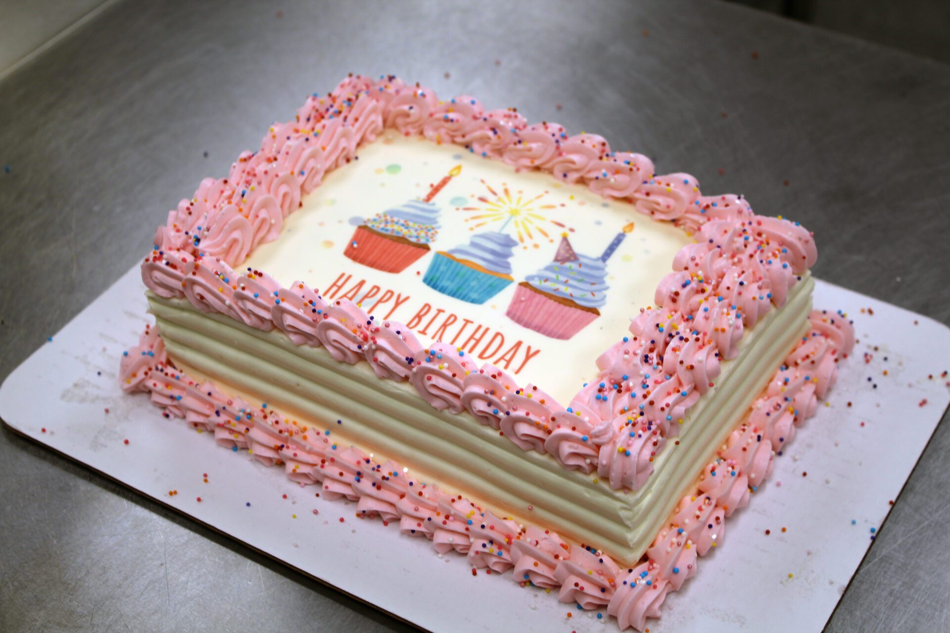 Pink and white birthday cake